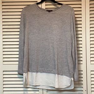 Light grey woman’s blouse with scoop neck